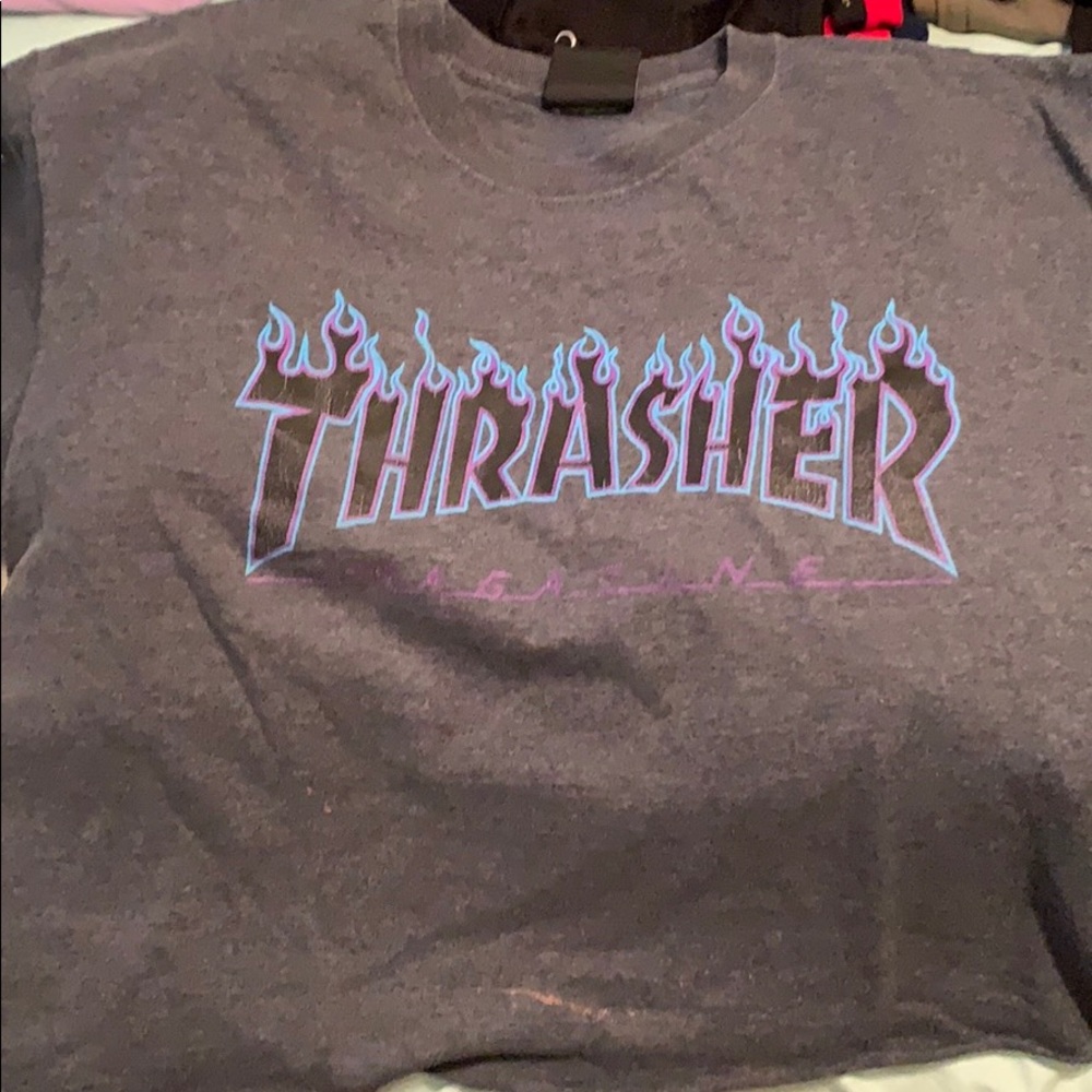 A cropped thrasher shirt